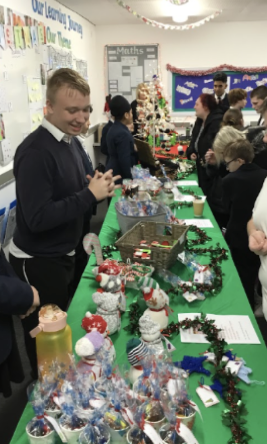 Student selling some of their Christmassy creations.