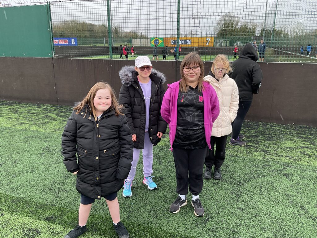 Milestone students playing football