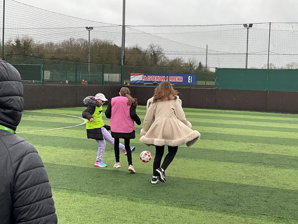 Milestone students playing football
