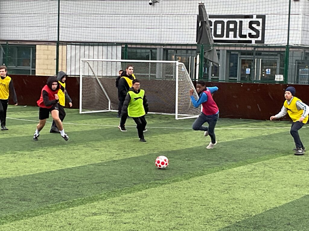 Milestone students playing football