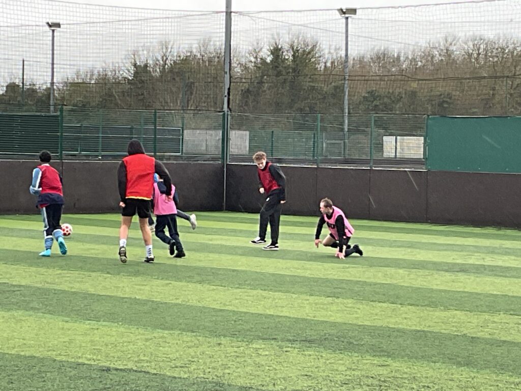 Milestone students playing football