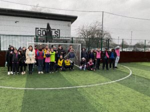 Milestone students stood in front of a football goal