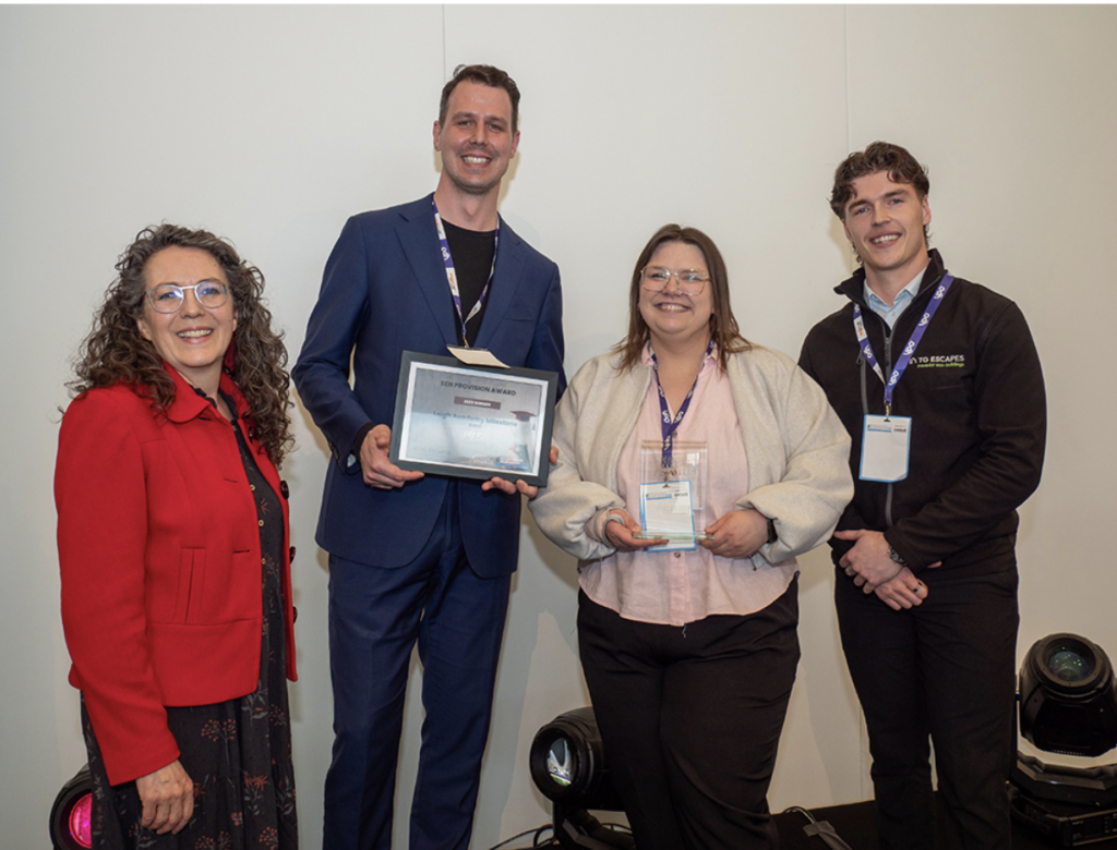 Team at Leigh Academy Milestone accepting an award