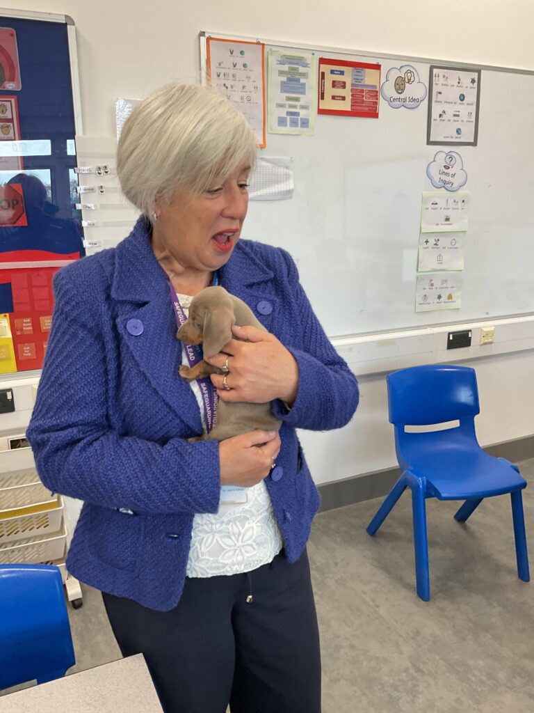 Sarah Goosani holding a puppy