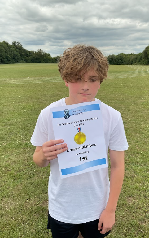Pupil with a 1st place sports day certificate